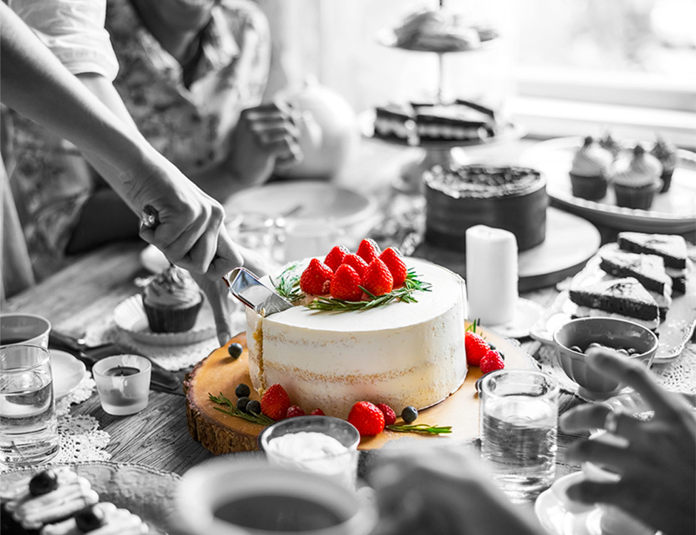 Cutting Strawberry Cheesecake at Party